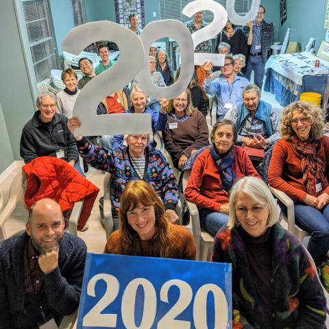 Indivisible group members holding "2020" signs