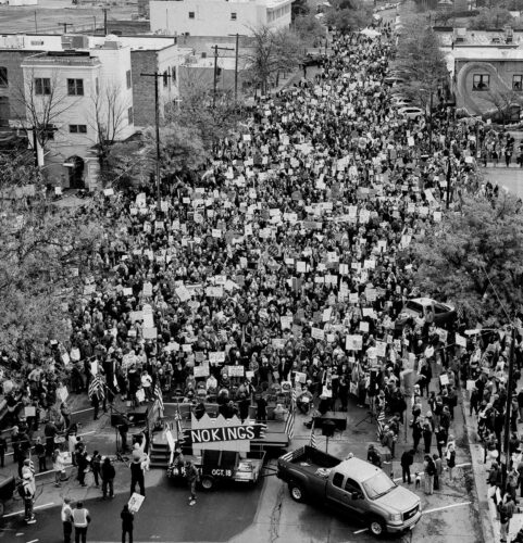 A drone photo of the No Kings 2 Protest in Missoula. A stage in the foreground shows a large No Kings banner.